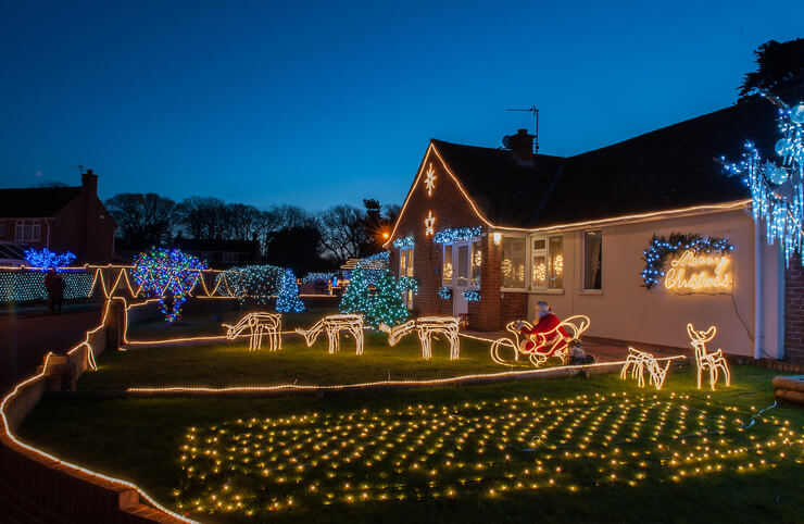 This image shows a house decorated with Christmas lights.