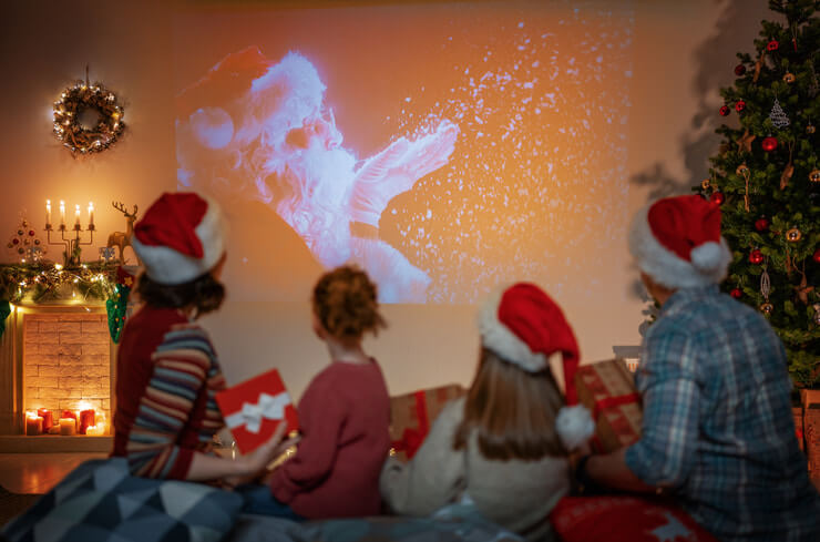 This image shows a family watching a Christmas movie.